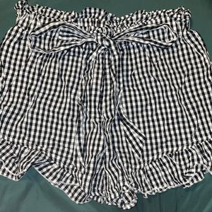 checker print shorts with ruffled ends and elastic waste band.